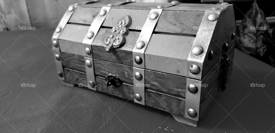 small wooden chest with beautiful metal details.