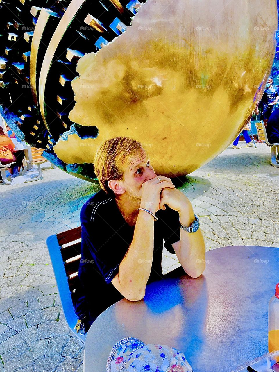 Timothy Trespas is sitting in front of a gigantic golden metal sphere, an art object on display at Mount Sinai hospital on Manhattan’s Upper East Side. 2020. Hypnotic Productions