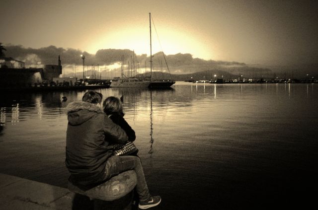 lovers in front of sea At sunset