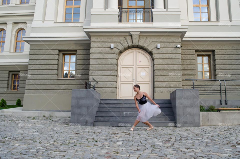 Young Female Ballerina Dancing Outside