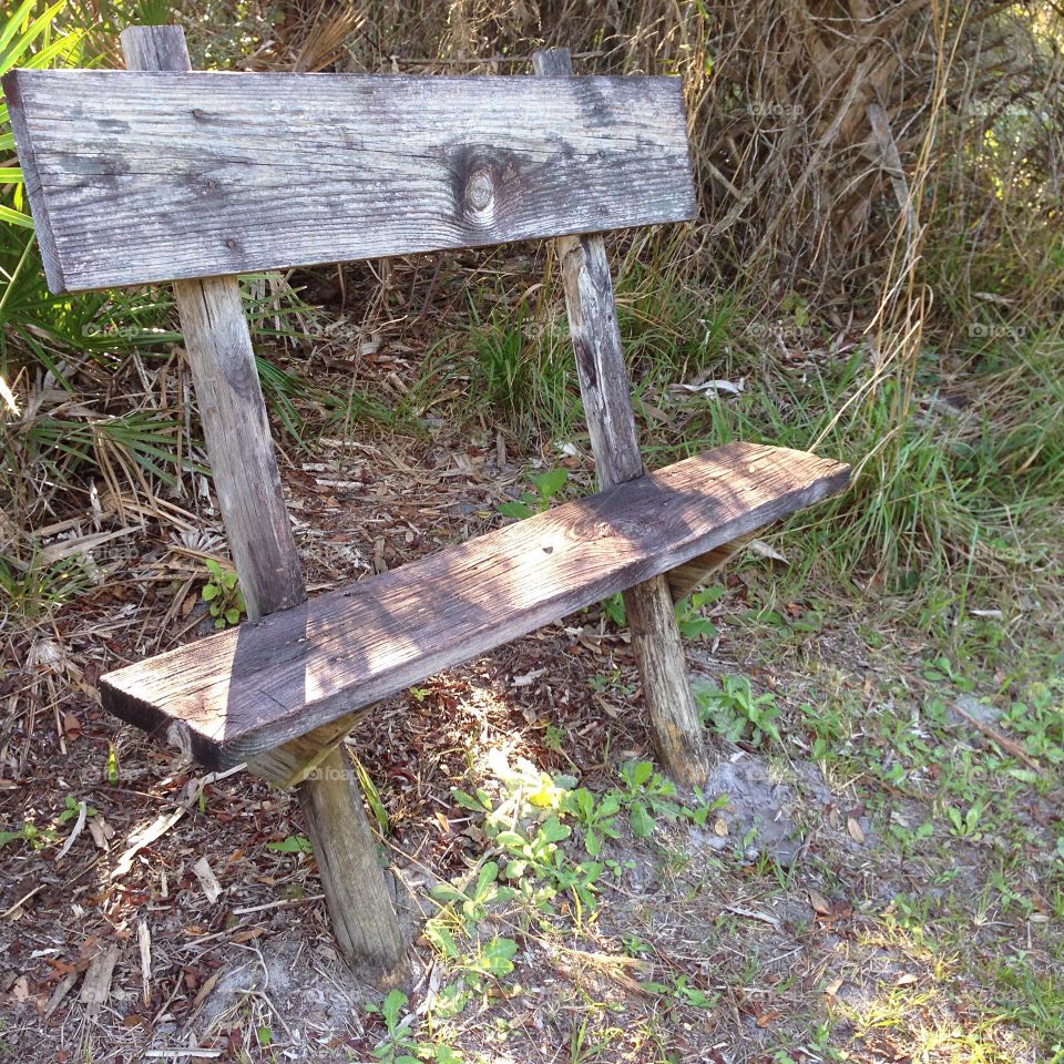 Rustic antiquated wooden bench.