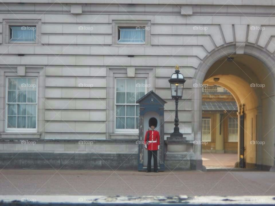 Soldier outside Buckingham palace. Standing still not moving, couldn't do. 