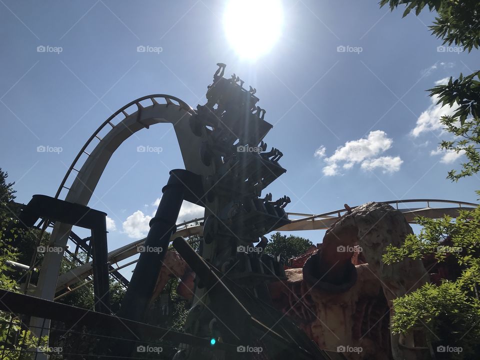 Summer sun gleaming over rollercoaster 