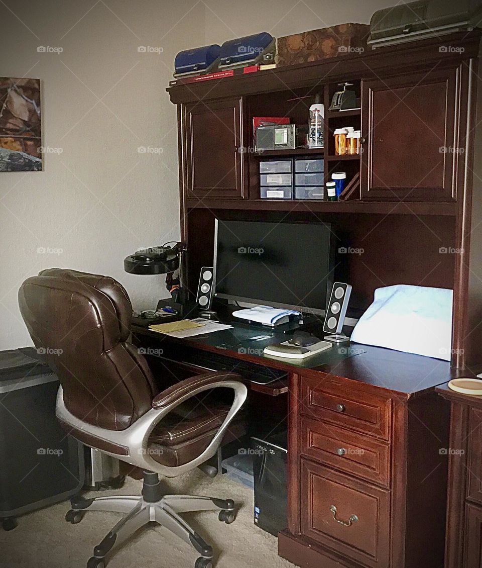 A busy desk in a home office.