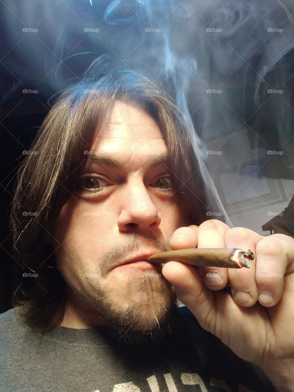 smoking a blunt
cannabis
stoner guy
long hair guy smoking weed