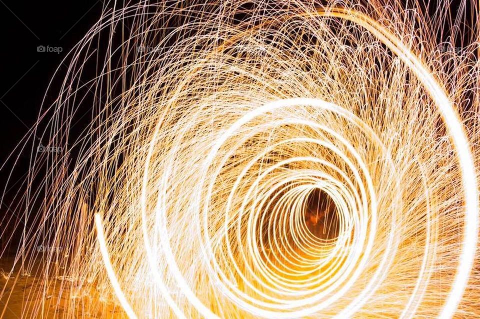 This warm and exciting light painting long exposure photo is sure to ignite passion is whatever you do. The lines and energy within this piece will carry over into any eye of whom beholds it.