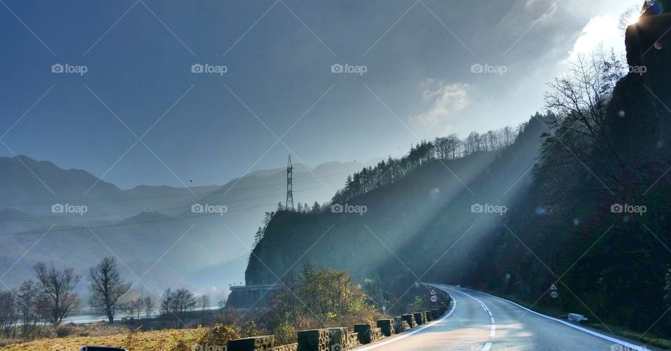 Empty road beside mountain