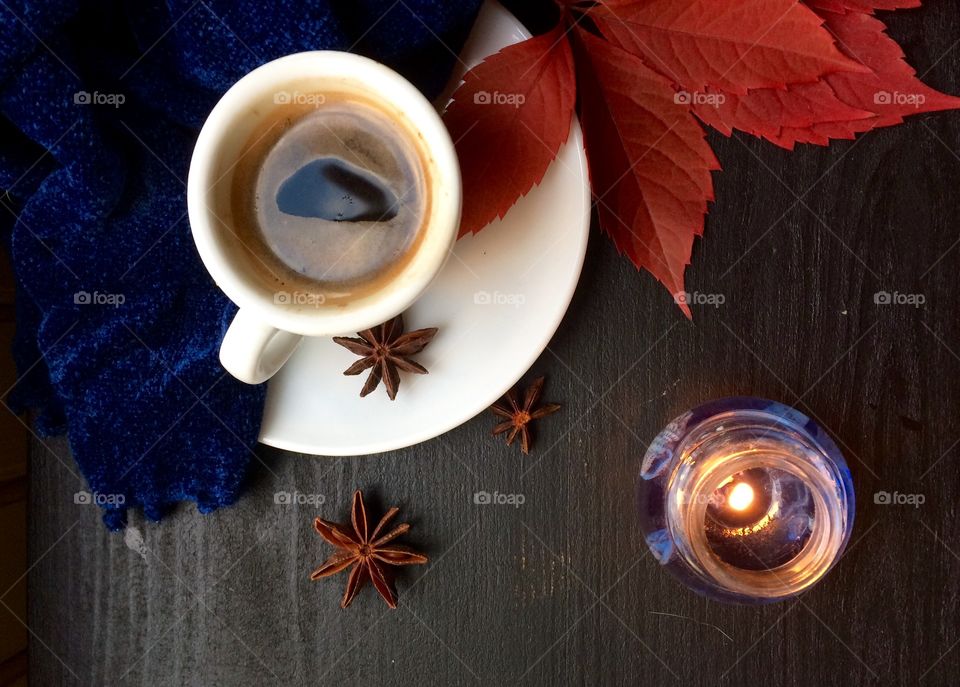 Close up of tea cup and candle