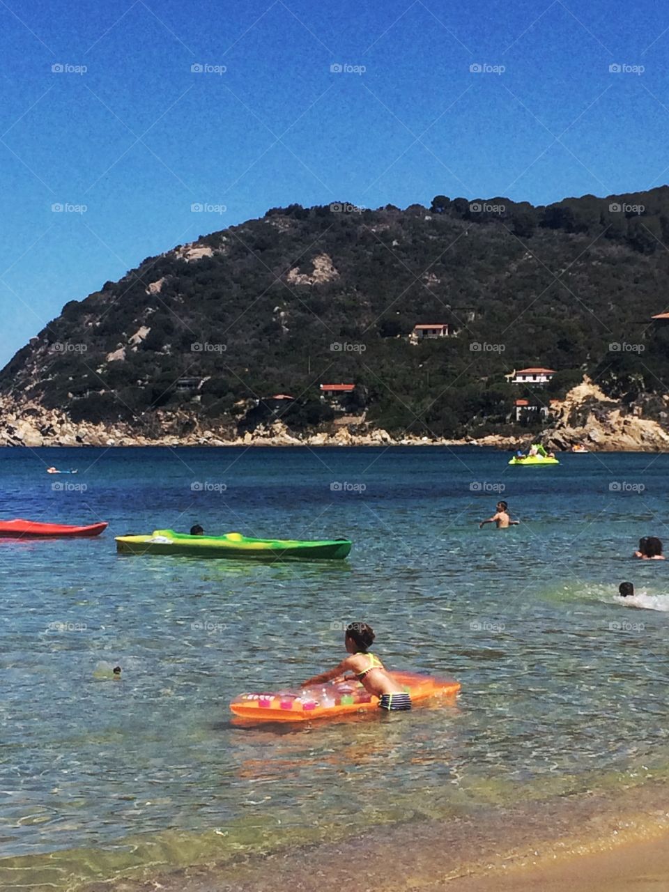 Baby playing on the sea
