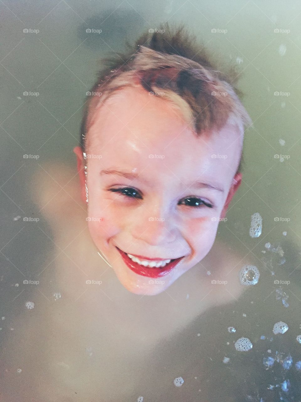 Boy taking a bath in the bathtub