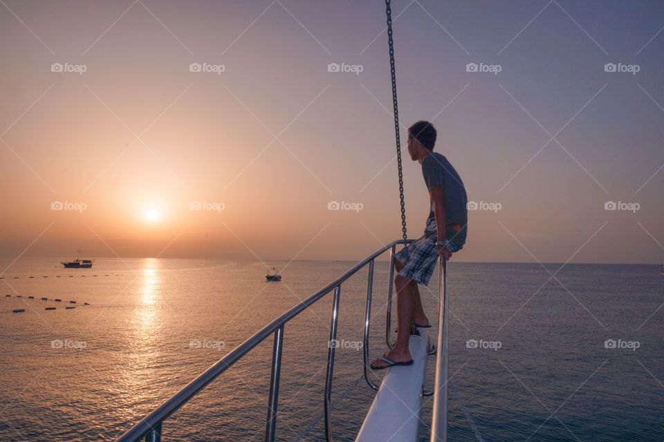 watching sunrise from a boat