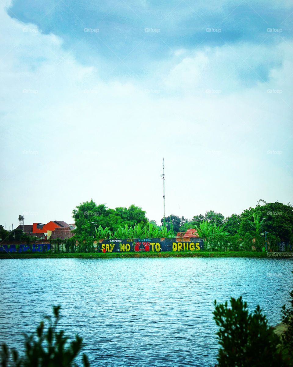 say no to drugs signage on the corner of a lagoon