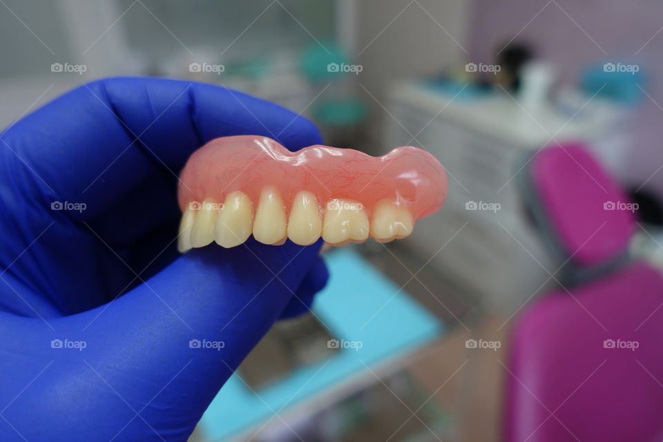 Dentures in hand doctor