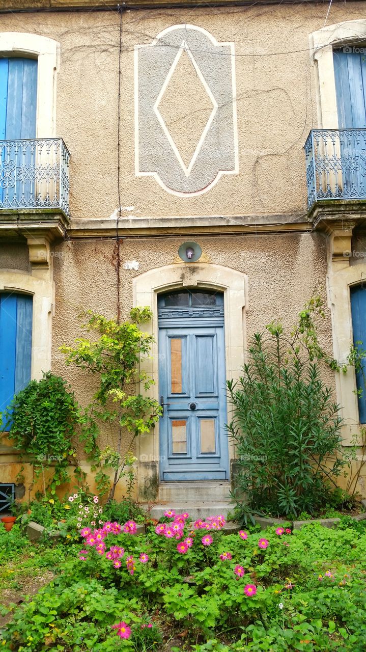 A colorful door and the garden in Montpellier, France
