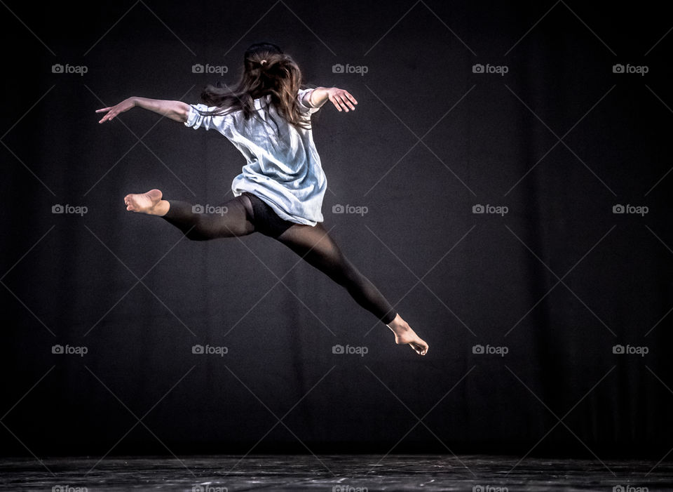 Woman Ballet Dancer Jumping In The Air