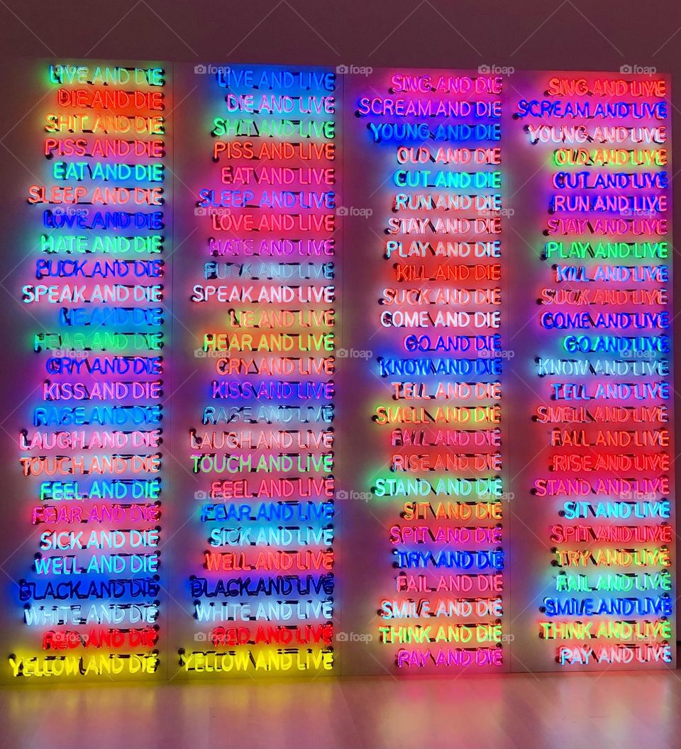 Repetition of short sentences in multicolored light neons at Moma museum in New York 