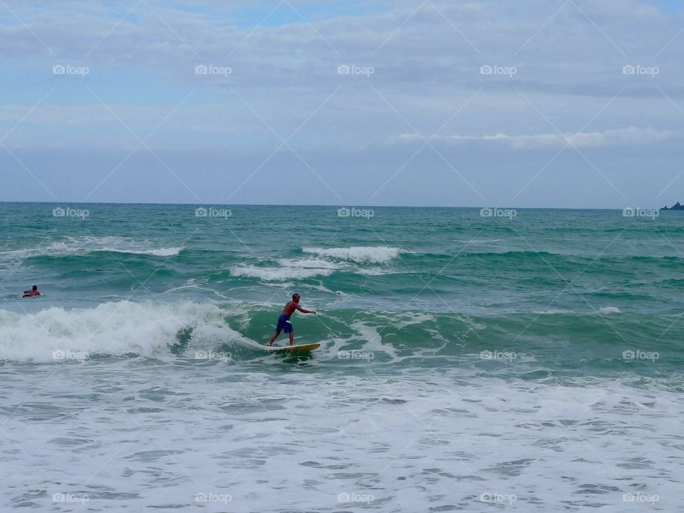 Catching a wave in Baler, Aurora, Philippines 