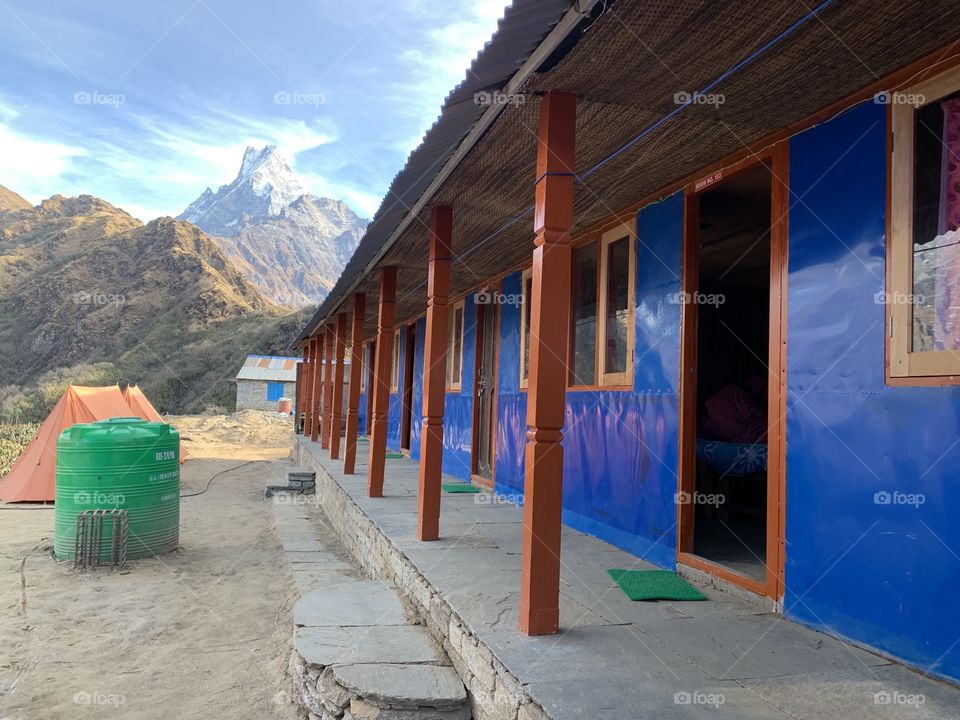 A colourful guesthouse in Nepal, looking out over the holy Machhapuchhre mountain... four days of trekking needed to see this gorgeous view