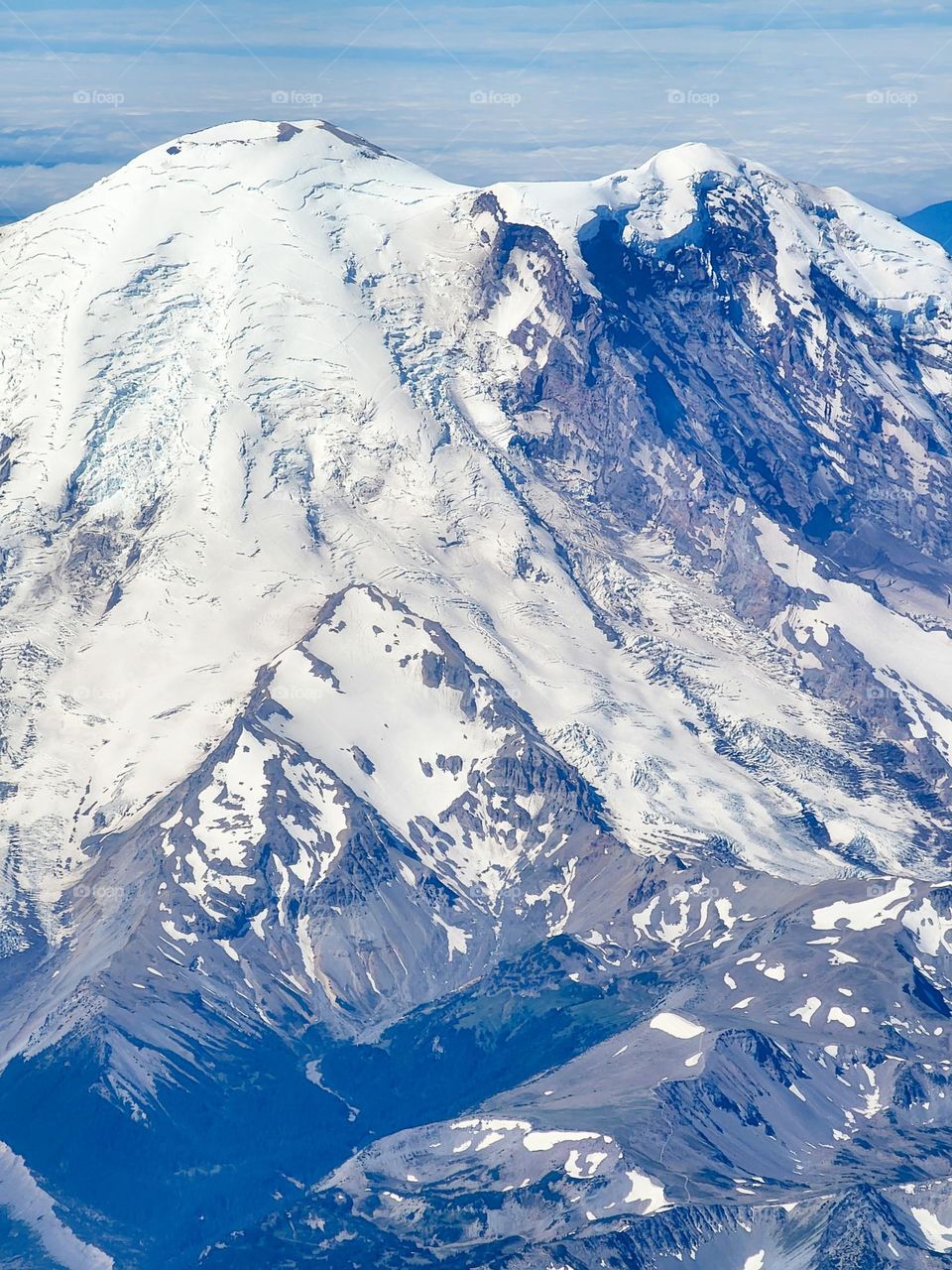 Mount Rainier in Washington state is snow covered even in the middle of summer thanks to it's impressive altitude
