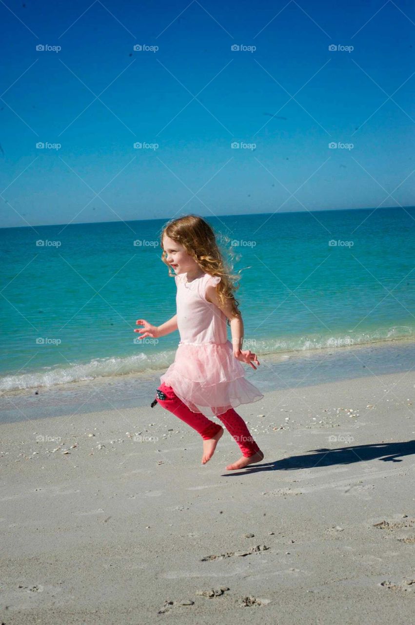 Lily running. running on the beach