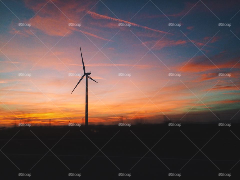 Wind turbine at sunset.