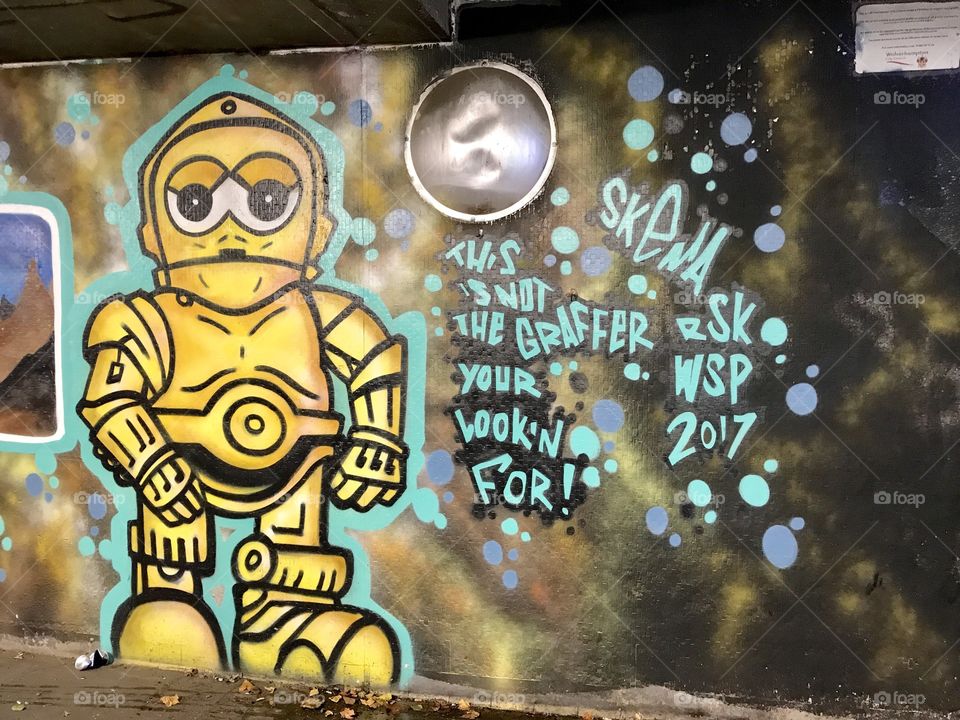 Graffiti robot in the subway. 