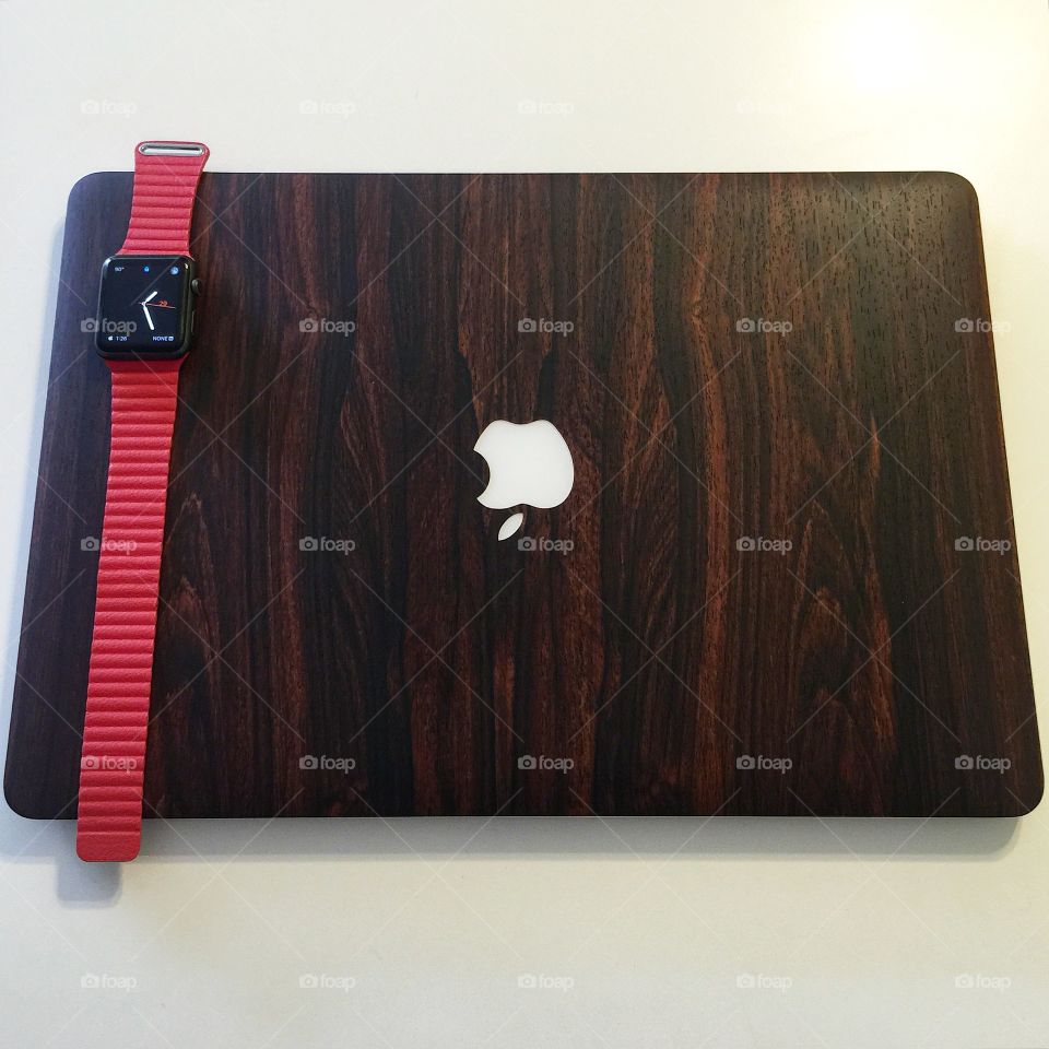 Apple Macbook and Apple Watch. MacBook with wood skin and Watch