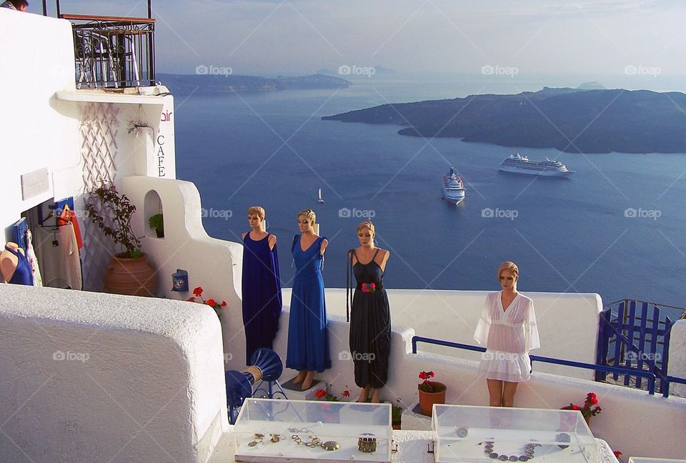 Mannequins posing along a patio in Oia, Santorini, Greece