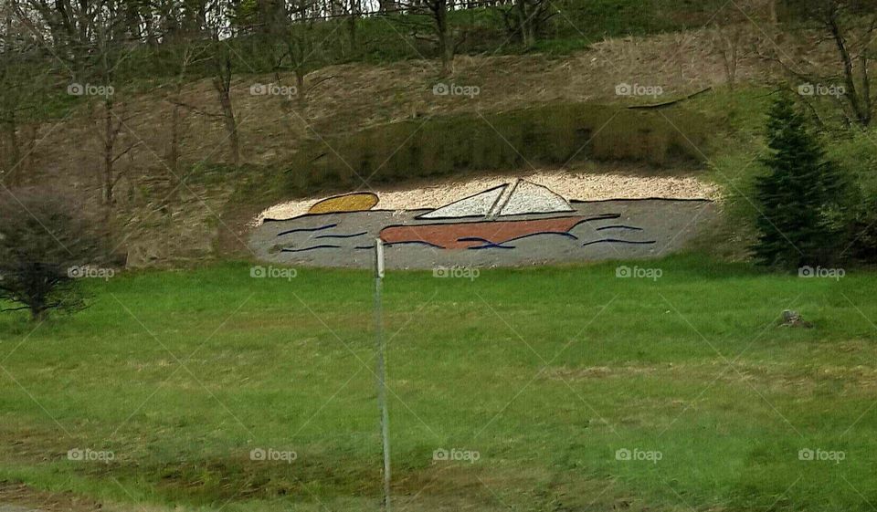 Artwork With Stones Along Road