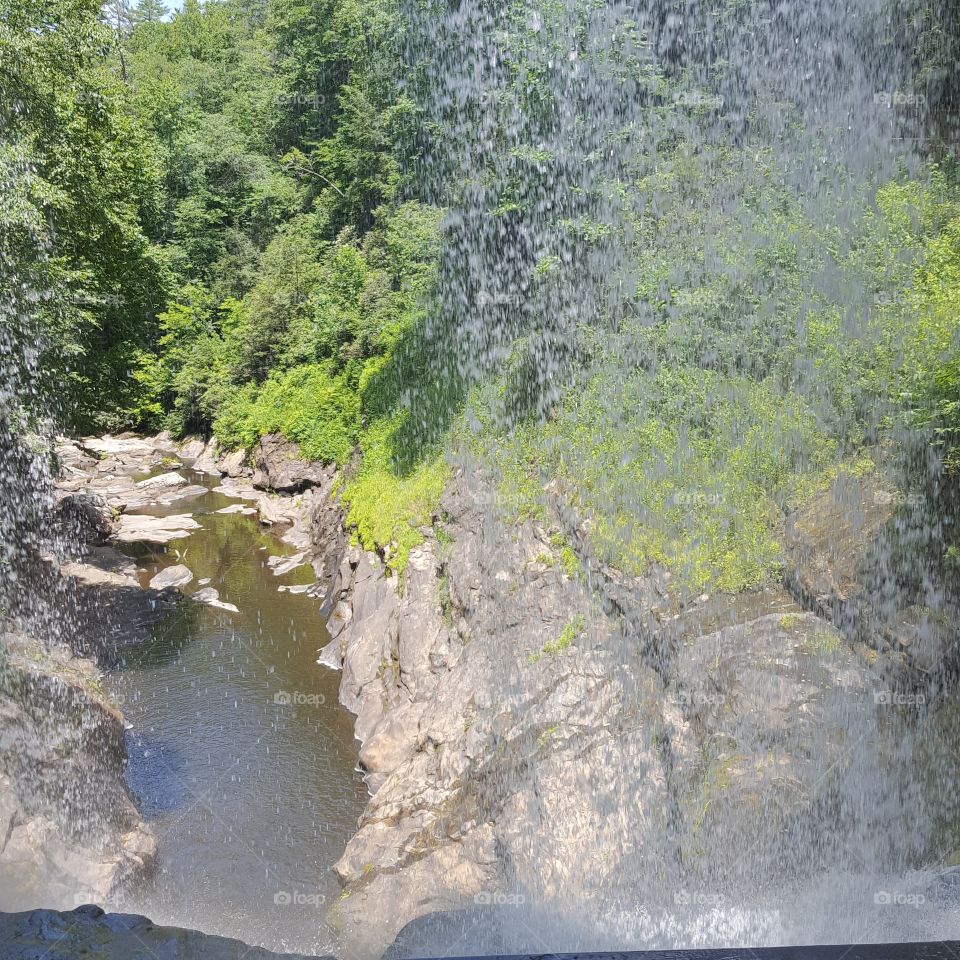behinde a waterfall