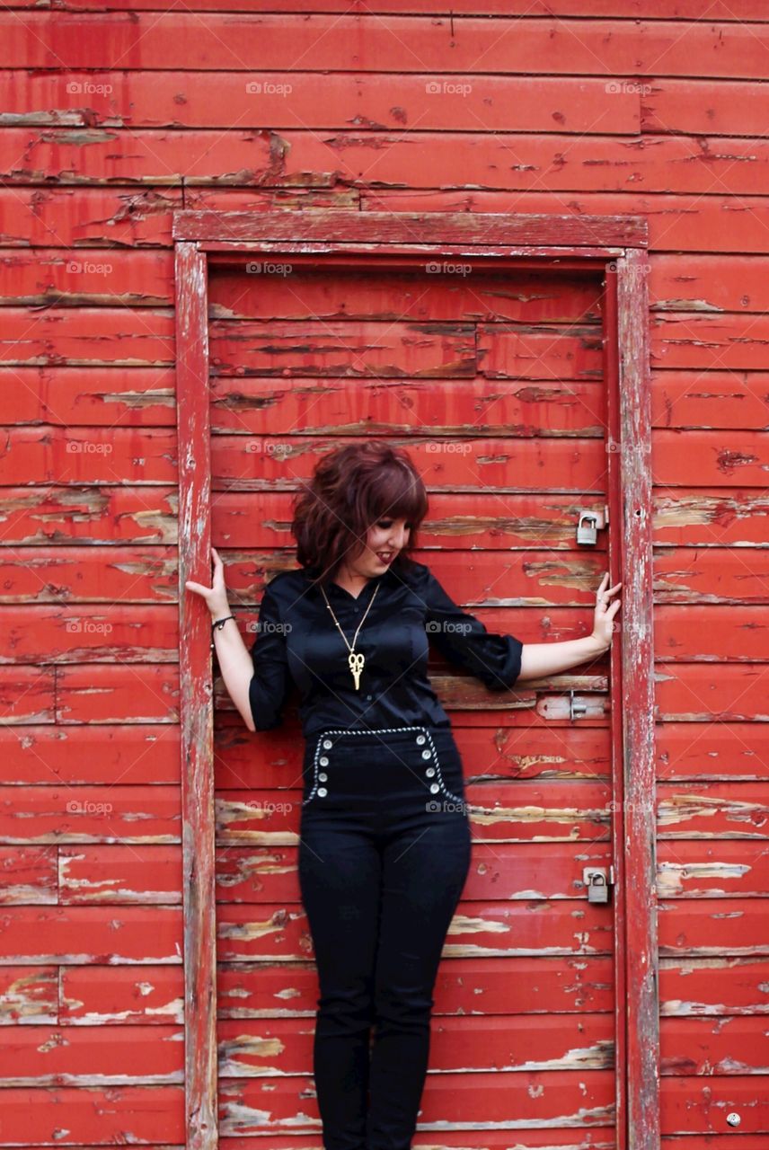 Distressed red wall and a beautiful girl 