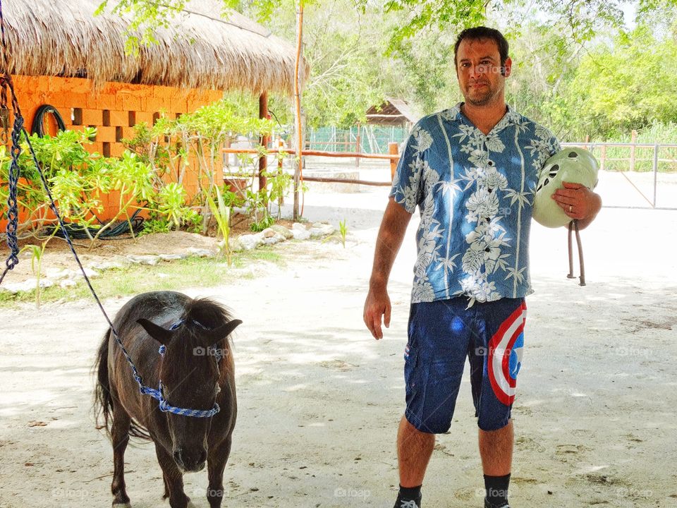 Visiting A Mexican Farm. American Tourist Visiting A Ranch In The Yucatán
