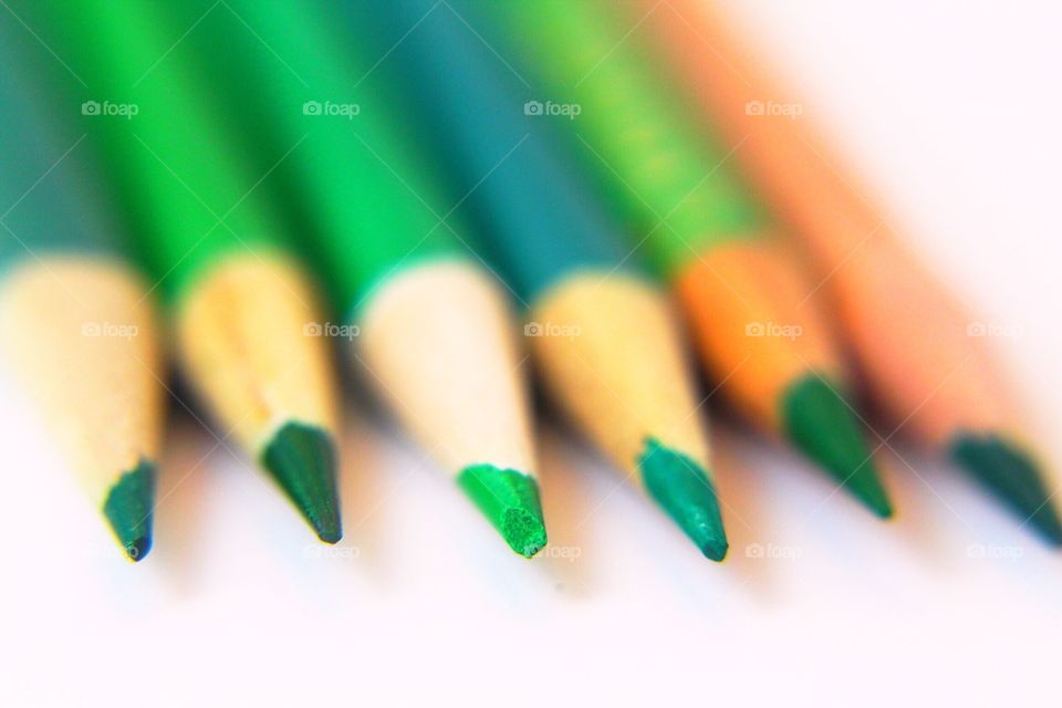 Green pencil points