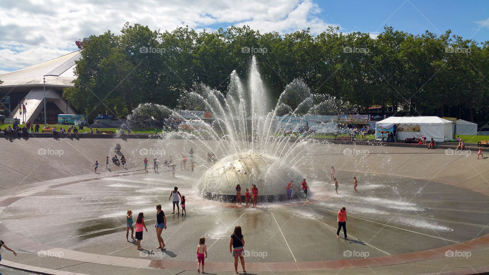 Kids playing in the Water Fountain at the Seattle Center