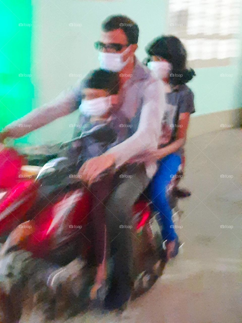 Father and children on a bike ride