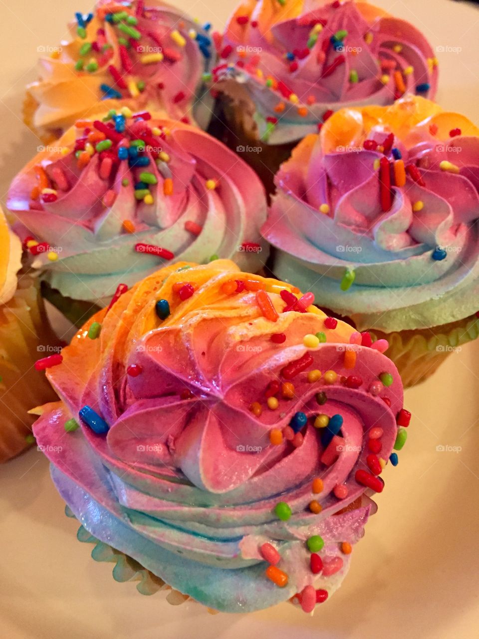 Colorful frosted crazy unique cupcake 
