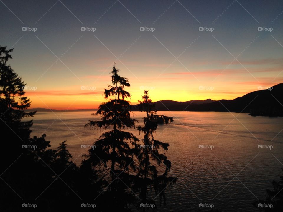 At the western tip of the mainland as the sun sets. 