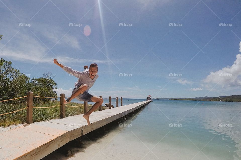 Man jumping in sea
