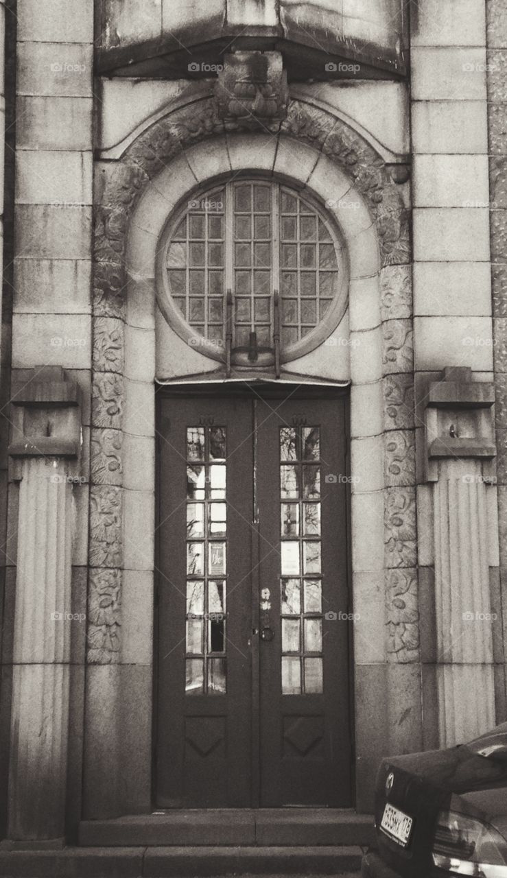 main entrance with black doors