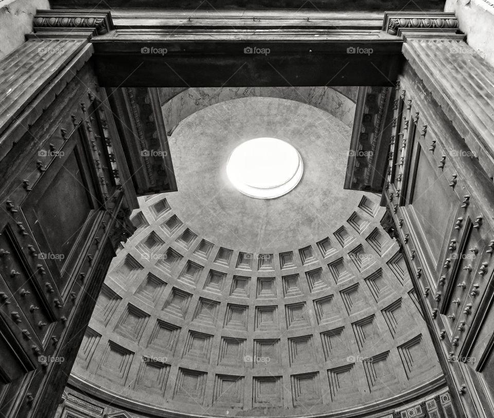 Pantheon interior view, with vaulted dome and oculus, photographed from main entrance by low angle. Rome Italy