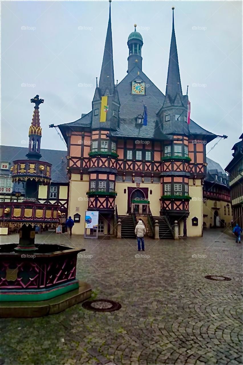These half timbered houses with thin round offset towers and long pointy steeples could be right out of a fairy tale. They are in the historic inner city of „Wernigerode“, „Harz“, „Saxony-Anhalt“ in former „East Germany“. 2024. Hypnotic Productions