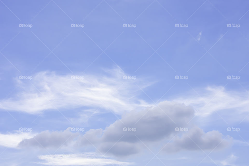 The beauty of the sky with clouds and the sun in summer.