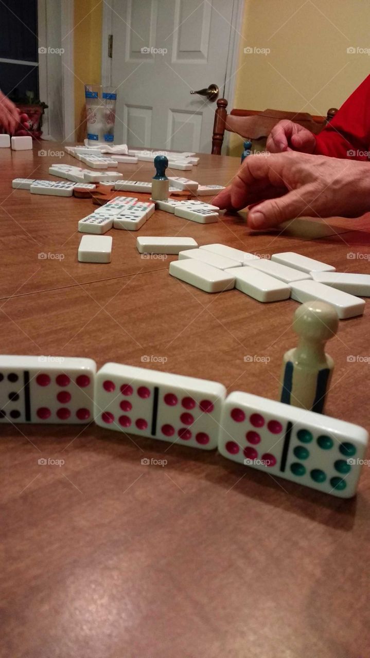 playing dominos game with family