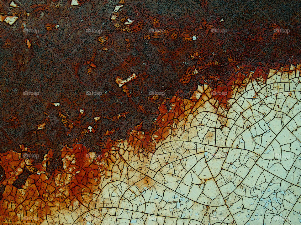 Rust, on the side of a forgotten car.