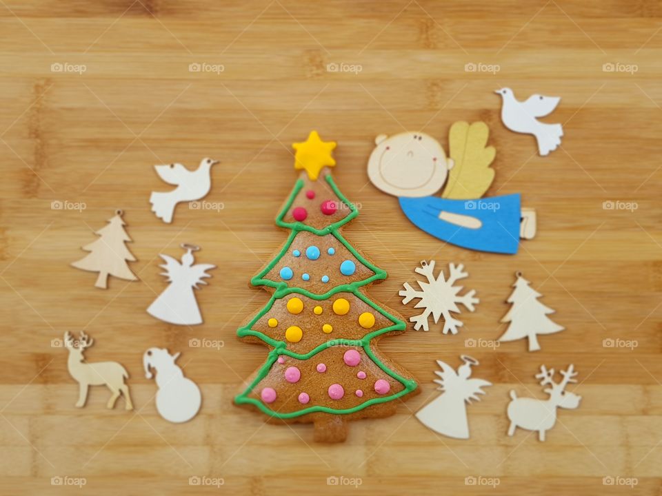 Merry Christmas with handmade gingerbread cookies and wooden objects