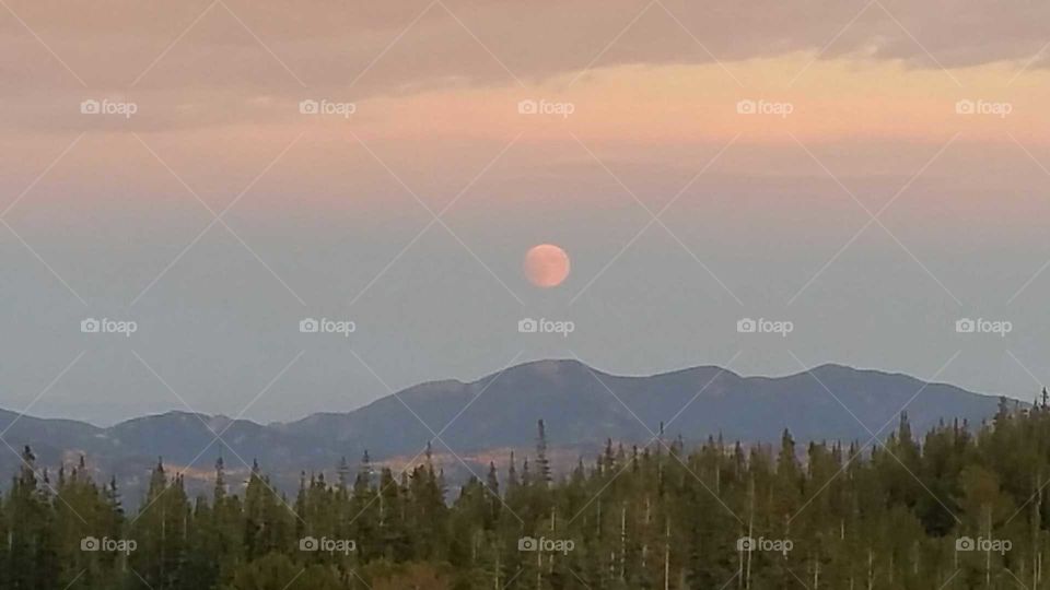 Blood moon over the mountains