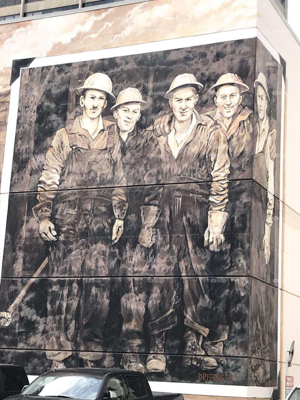 Historic painting of miners in Downtown Calgary near the 8th street train station. 