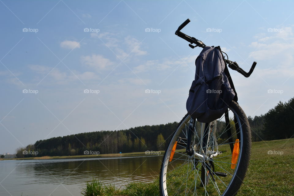 bike and backpack on nature landscape, social distance