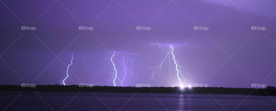 Lightning over the lake. This is a photograph of lightning over Lake Grapevine.