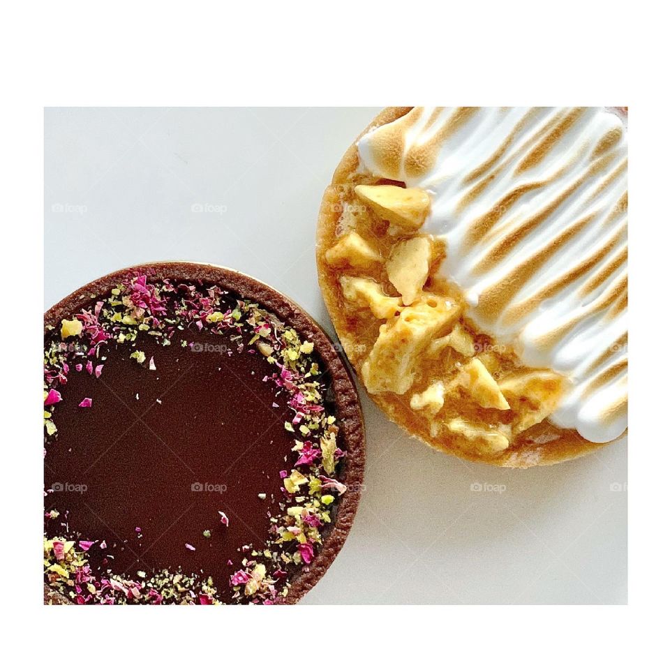 Perfect duo tart in chocolate pistachio rose tart and lemon strawberry meringue tart